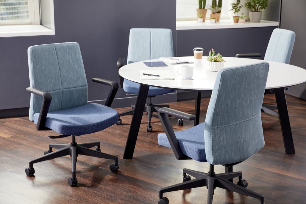 HON Cofi mid-back chairs around table in light blue
