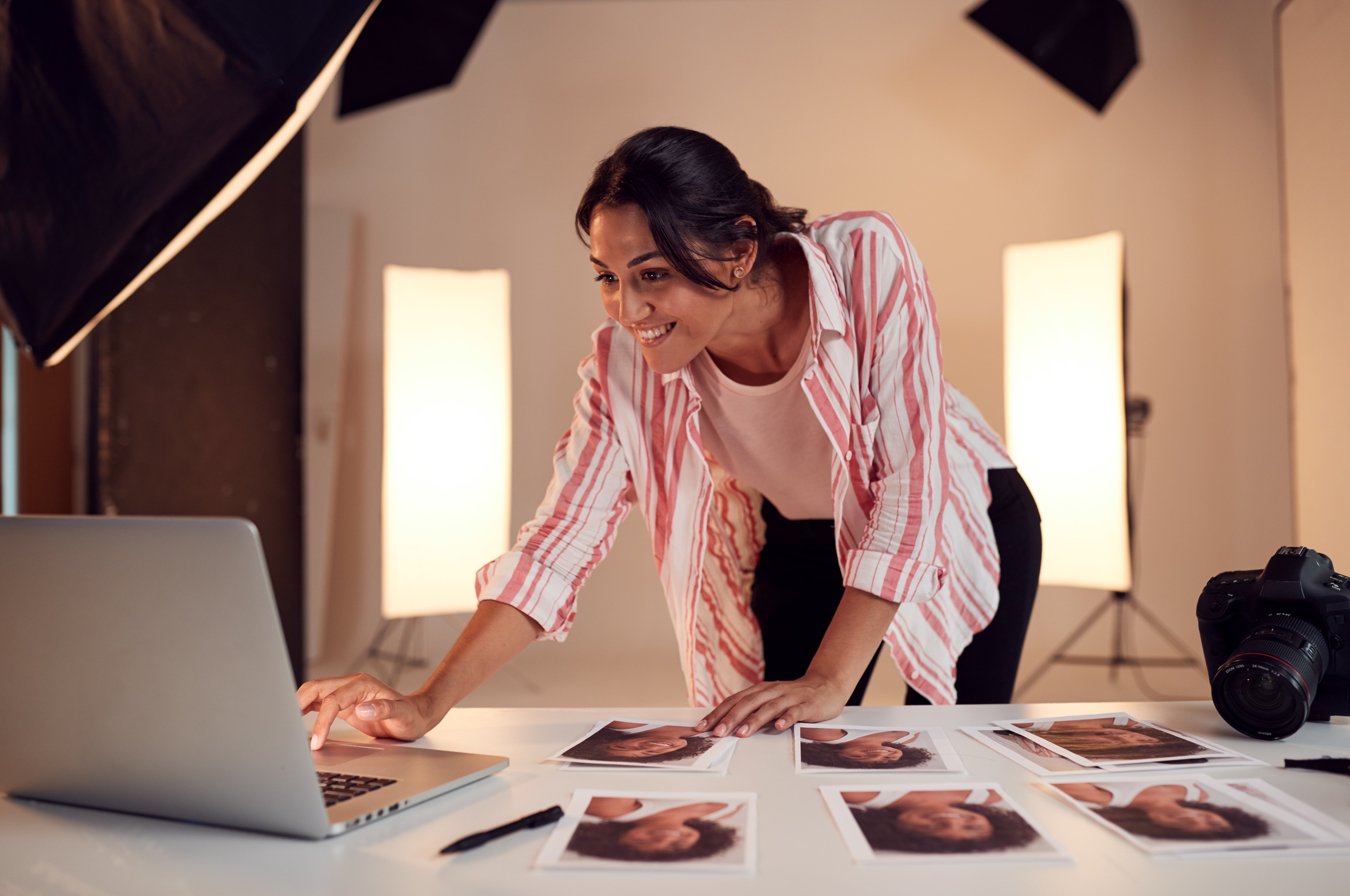 female-photographer-editing-images-from-photo-shoo-2024-10-22-07-58-41-utc