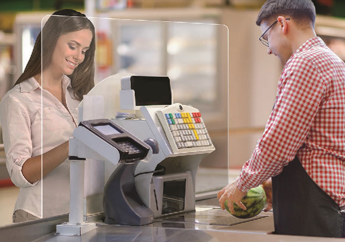 cashier and customer behind barrier