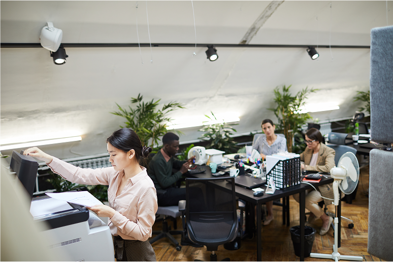 young-businesswoman-printing-documents-in-office-2025-03-10-00-07-13-utc